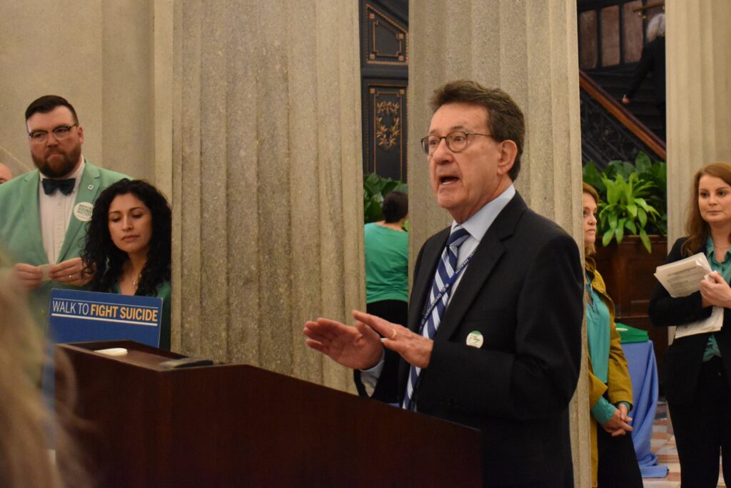 State Director of South Carolina Department of Mental Health, Robert Bank, MD, speaks to a crowd in the Capitol rotunda.
