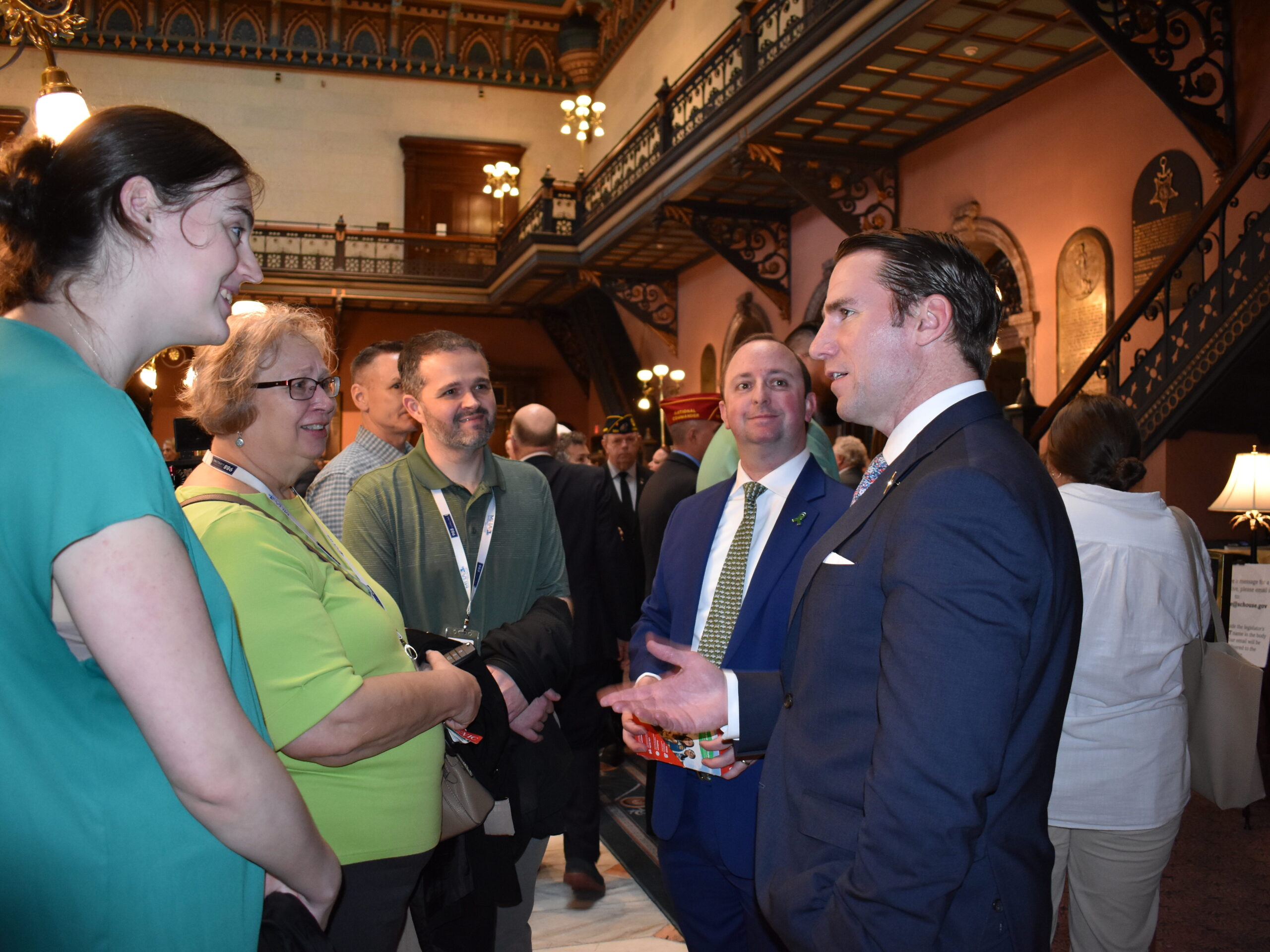 Nicole Coleman, Kathy Eckart, Adam Lindsley, and David Carter, representing MHAGC, speak with House of Representative Member Bobby Cox of Greer.