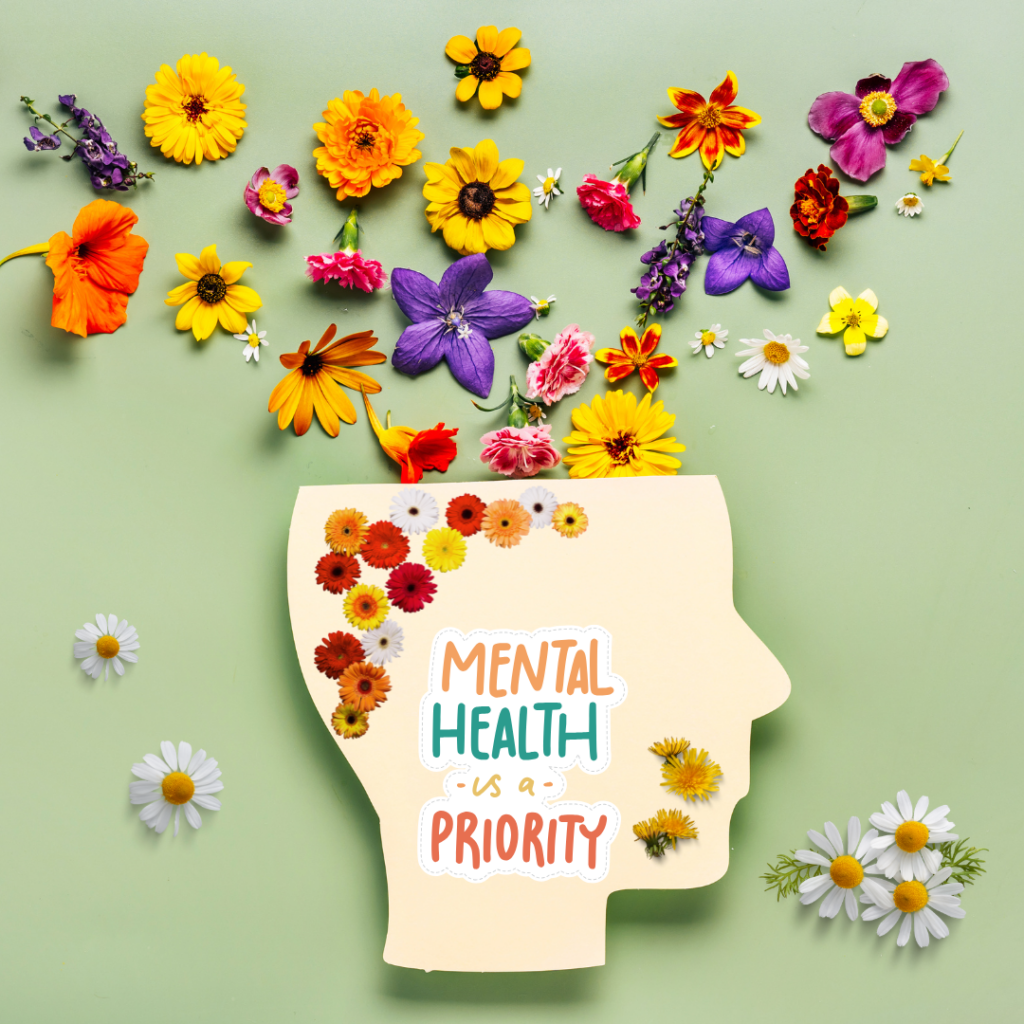 On a green back ground a graphic of a silhouetted head with flowers coming out of it and the words Mental Health is a Priority.