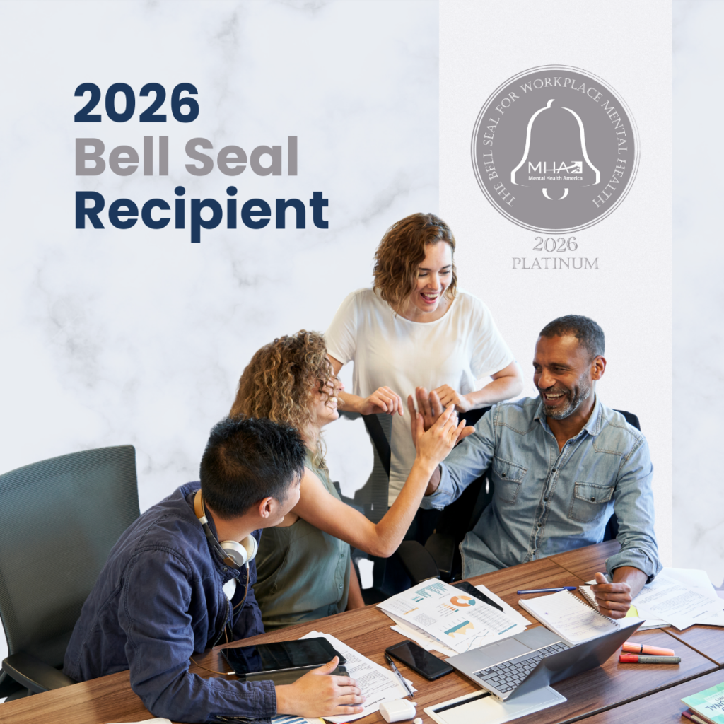 A group of smiling professionals high fiving each other over a messy desk. 2027 Bell Seal Recipient and the Bell Seal are displayed.